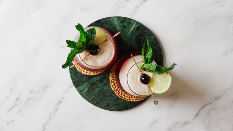 Overhead view of two glasses of the frozen shirley temple mocktail