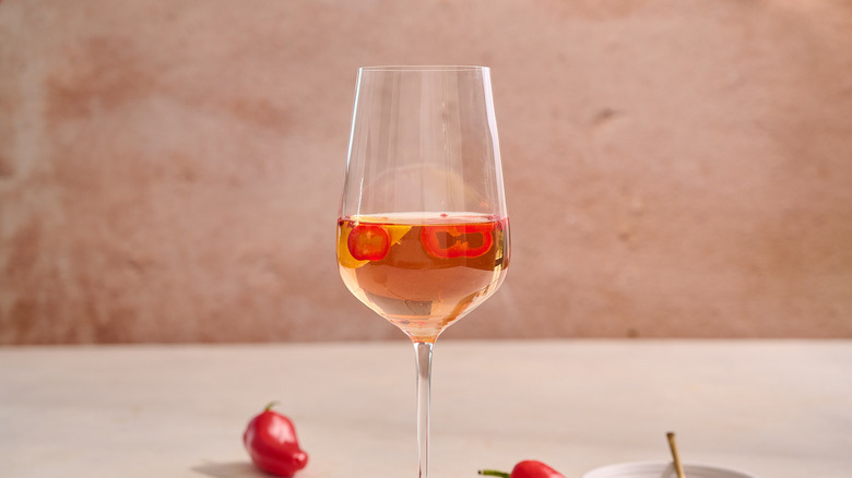 spicy rose in glass on table