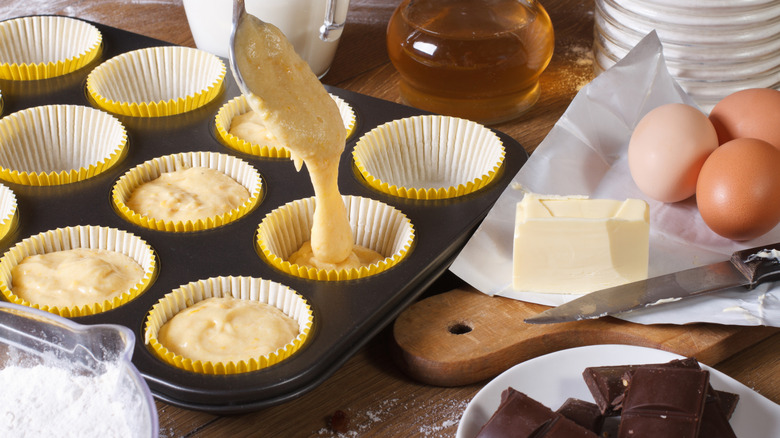 Making muffins with butter