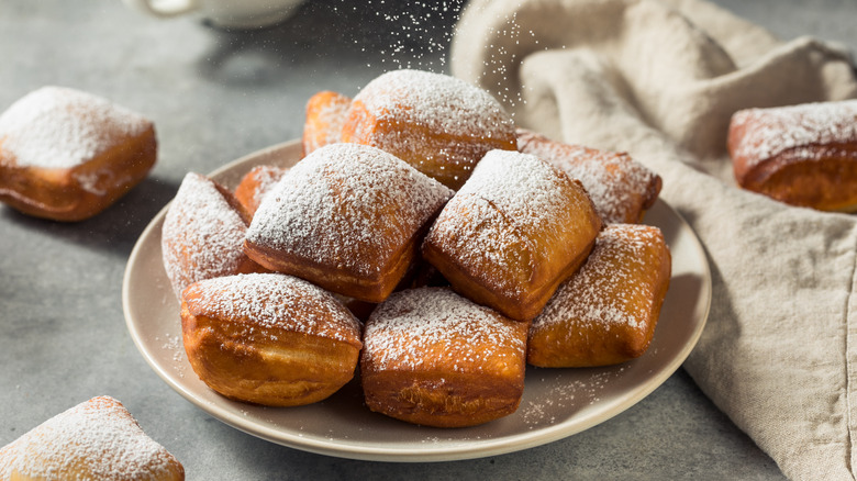 beignets topped with powdered sugar