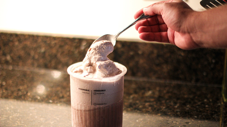 Frozen hot chocolate with hand