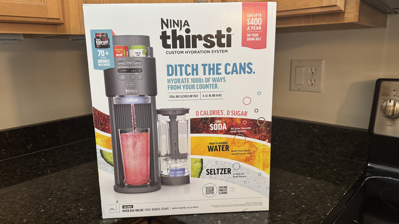 The Ninja Thirsti hydration system sits in its box on a countertop.