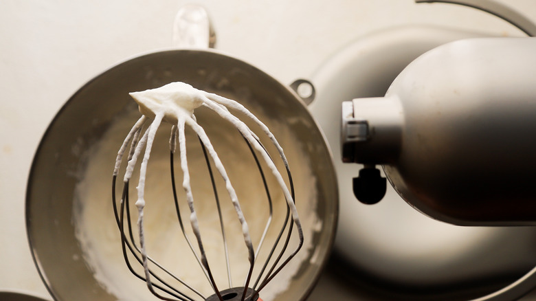 Whipped cream on whisk