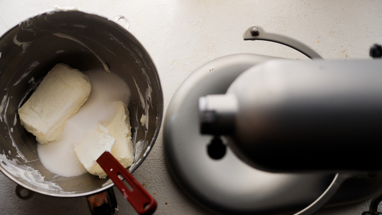 Cheeses and sugar in bowl