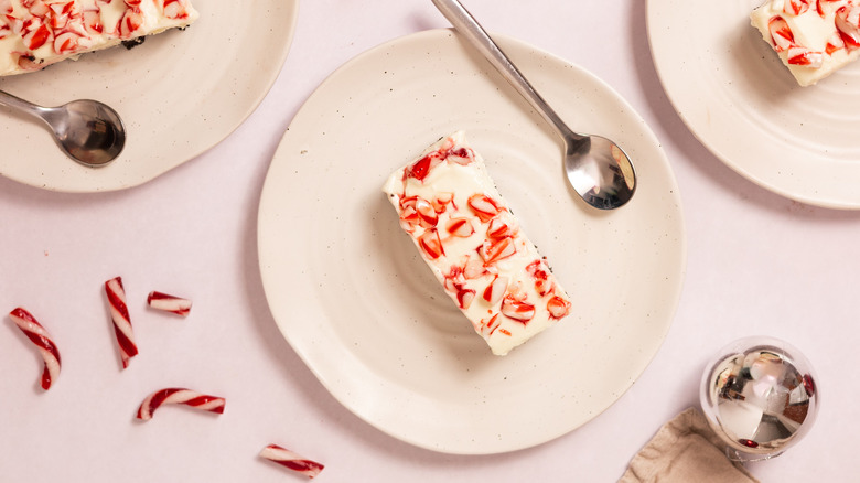 cheesecake bar on plate with spoon