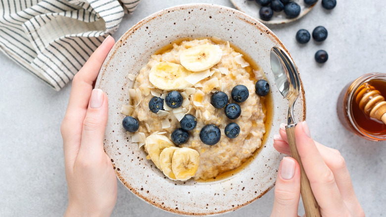 bowl of oatmeal with blueberries and bananas
