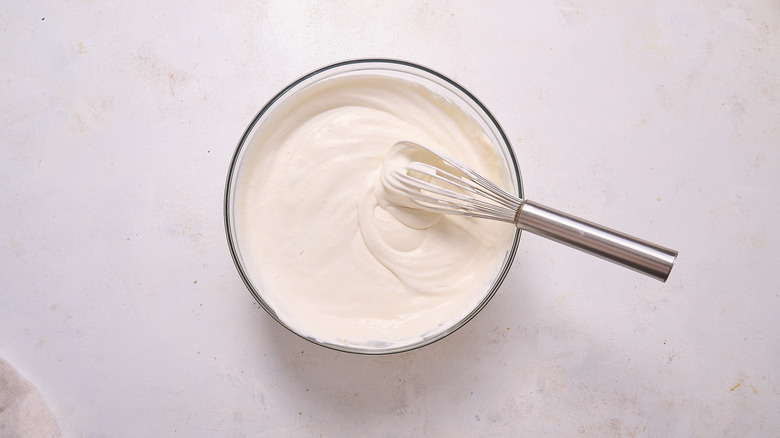 whisking bourbon into whipped cream