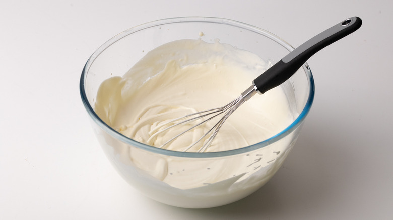 whipped cream in glass bowl 