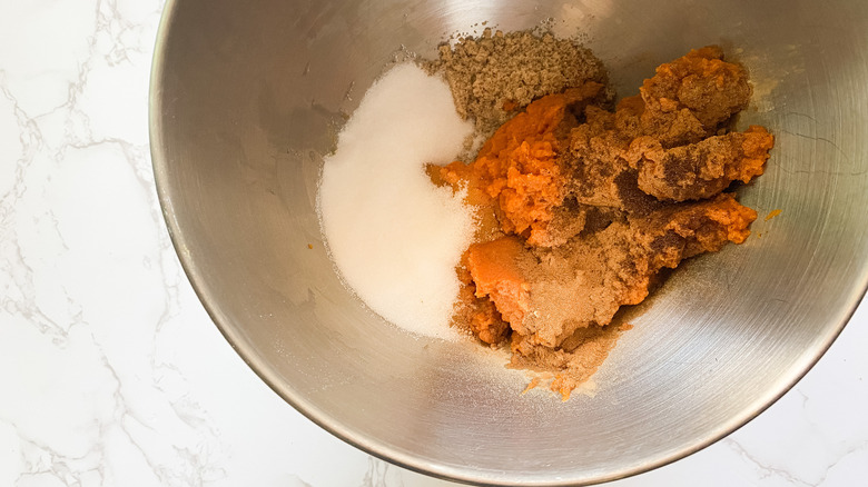 pumpkin and sugar in mixing bowl