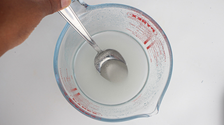 Stirring sugar in water