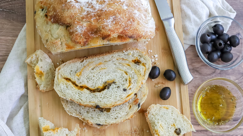 no-knead olive cheese bread on a cutting board