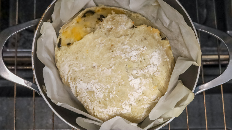 partially baked bread dough in a Dutch oven