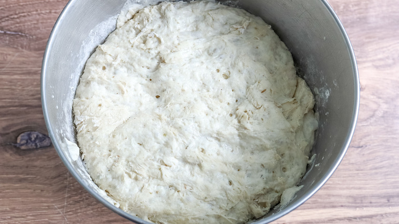 bread dough risen in a bowl