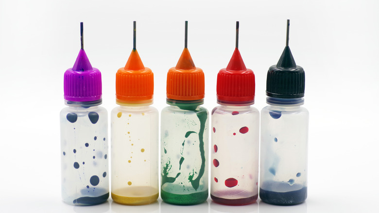 Five bottles of food coloring