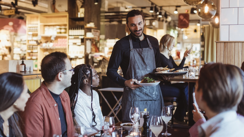 Server waiting on a table in a restaurant