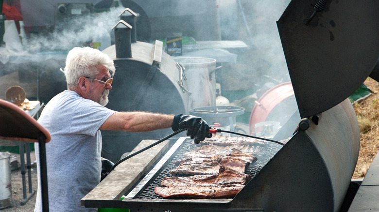 man barbecuing pork in north carolina