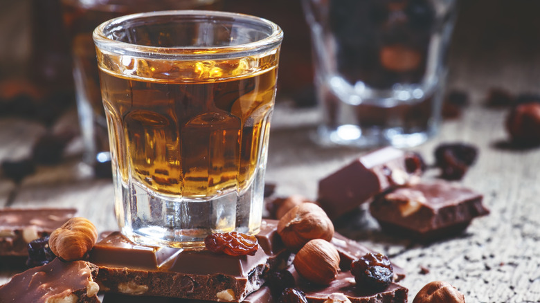 glass of rum with chocolate and hazelnuts