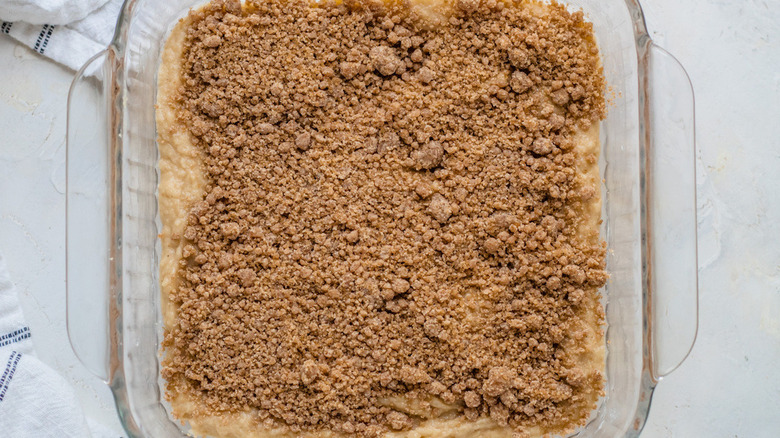 unbaked cake with sugary crumbles