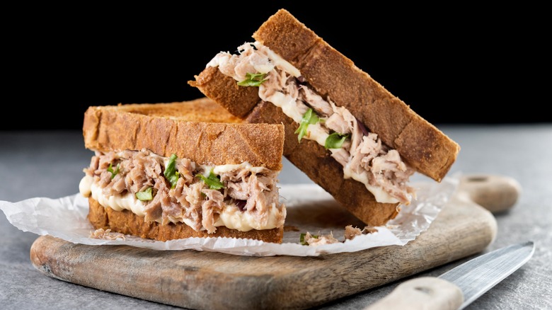 Tuna sandwich on wooden board