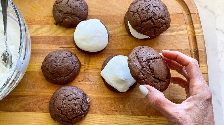 assembling whoopie pies and frosting 