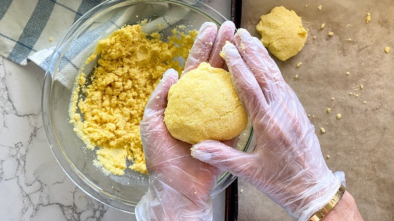 cornbread dough with hands