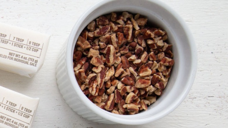 chopped pecans in white bowl
