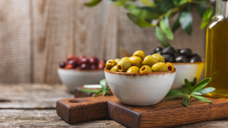 Different types of olives in bowls