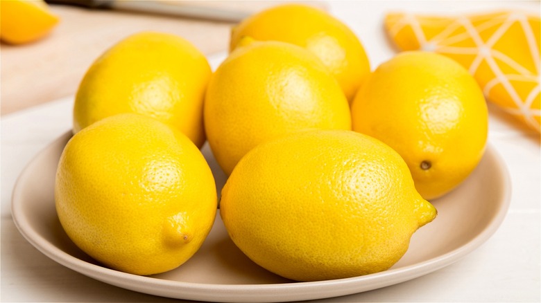 plate of lemons on white surface