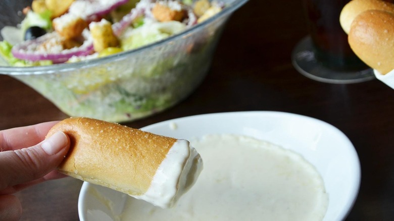 Olive Garden salad, breadsticks, and Alfredo sauce