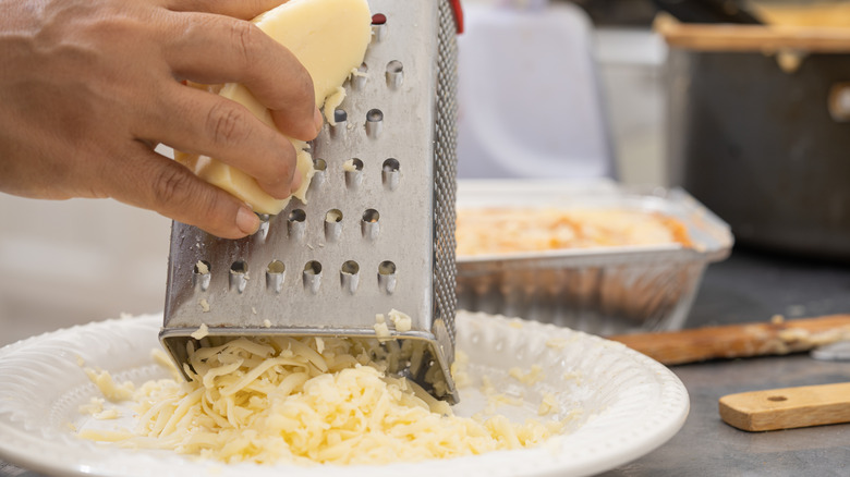 Mozzarella cheese being grated