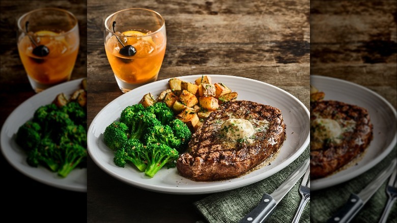 Carrabba's steak with broccoli and potatoes on plate