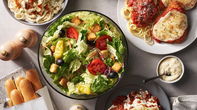 pasta entress, salad, and breadsticks from Olive Garden