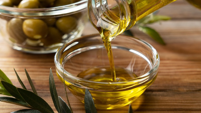 olive oil poured into glass bowl