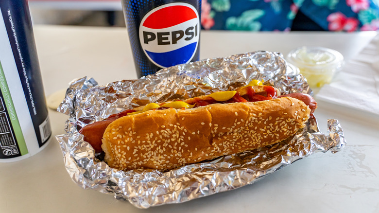 Costco hot dog and drink on table