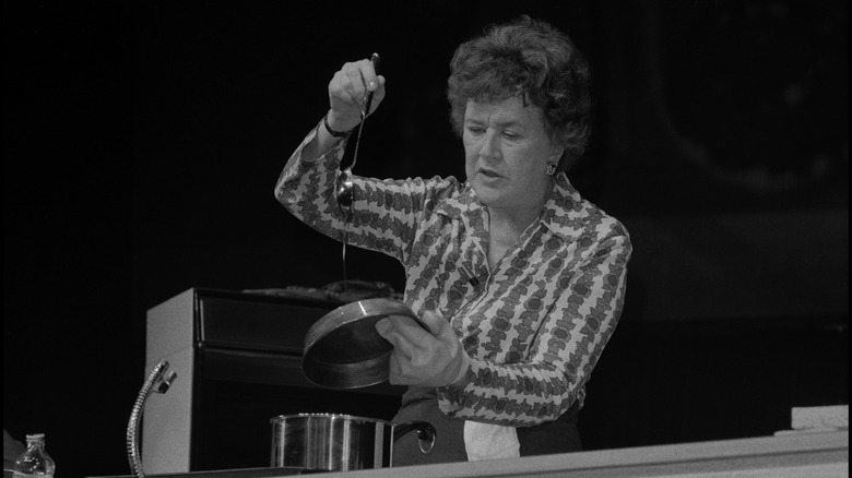 Julia Child cooking on stage