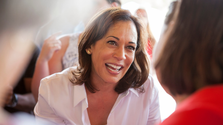 Kamala Harris smiling at woman in crowd