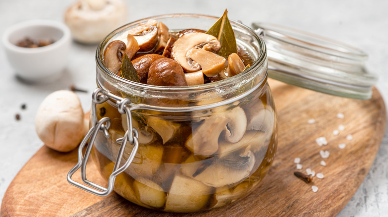 pickled button mushrooms in glass jar