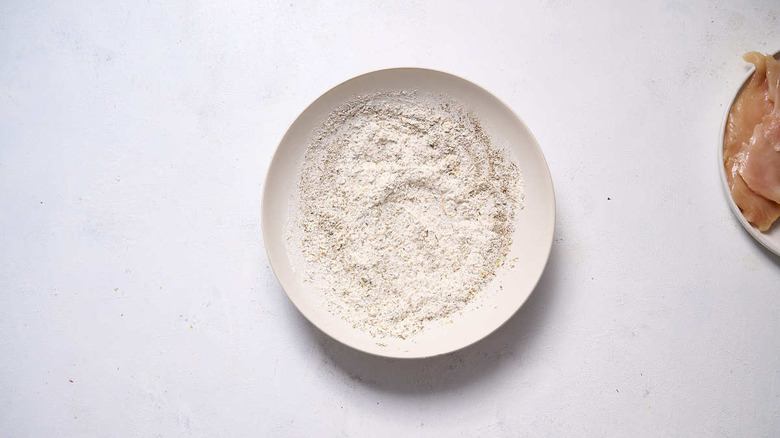 seasoned flour in white bowl