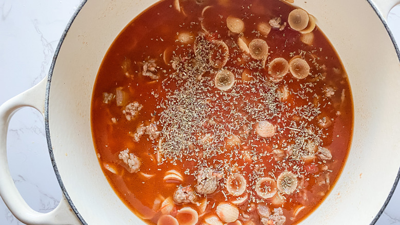 pot with pasta and seasoning