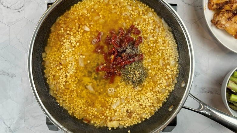 couscous and tomatoes in liquid