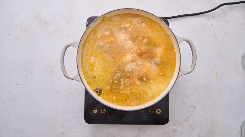 broth and milk in pot