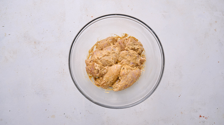 marinating chicken in bowl