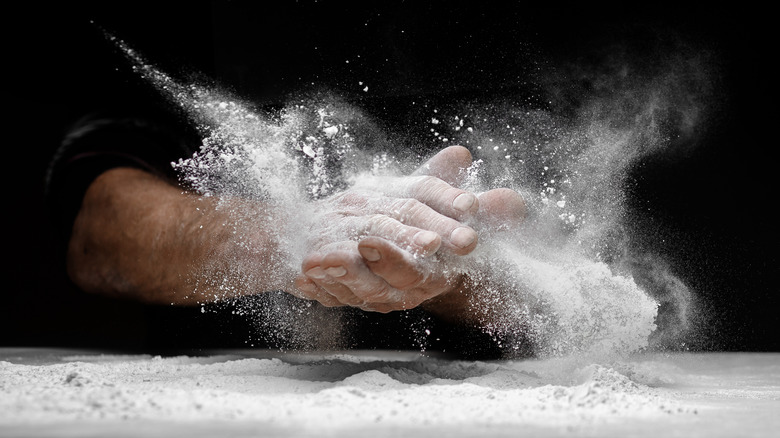 hands in flour