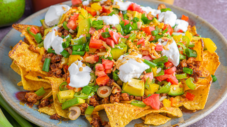 a plate of loaded nachos