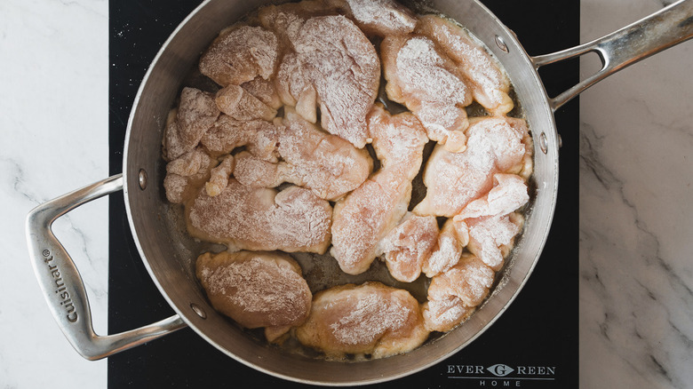 cooking floured chicken cutlets