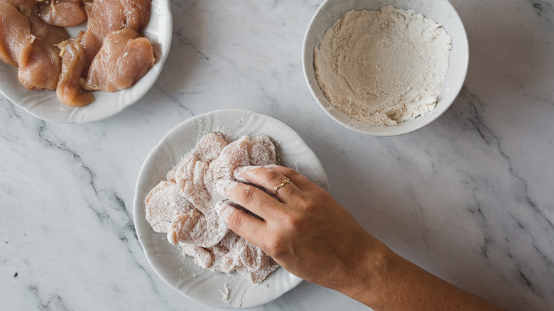 dredging chicken in flour