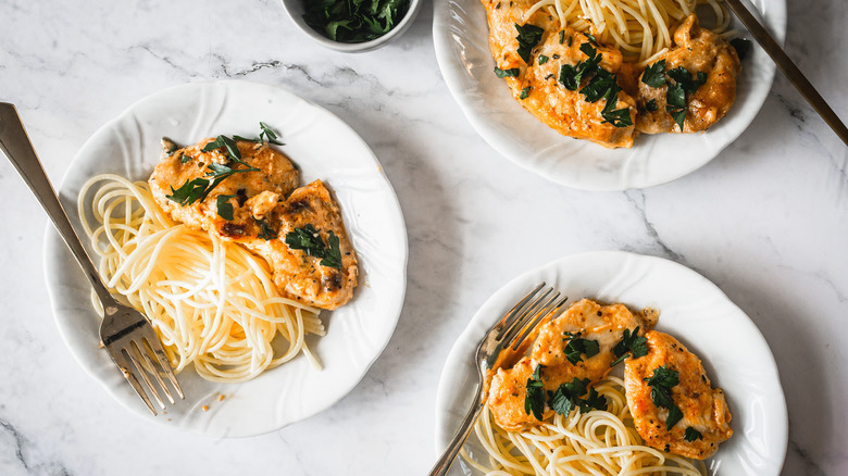 three plates of chicken lazone