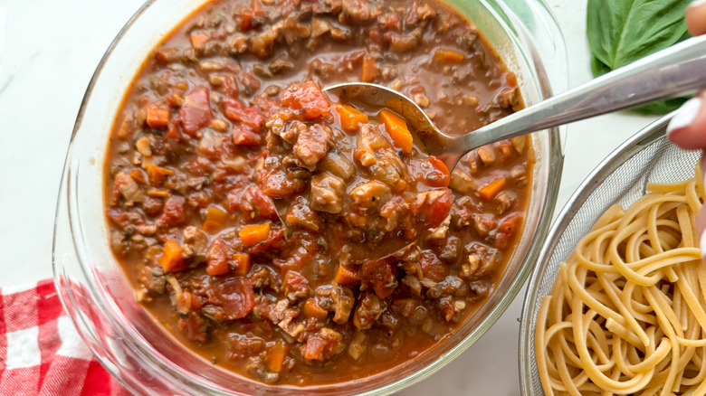 mushroom bolognese sauce in glass bowl