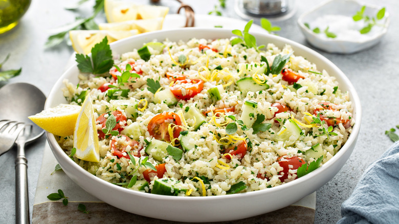 Cauliflower rice salad with tomatoes and cucumber