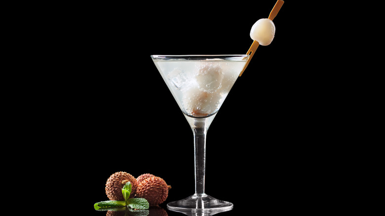 lychee martini on black background